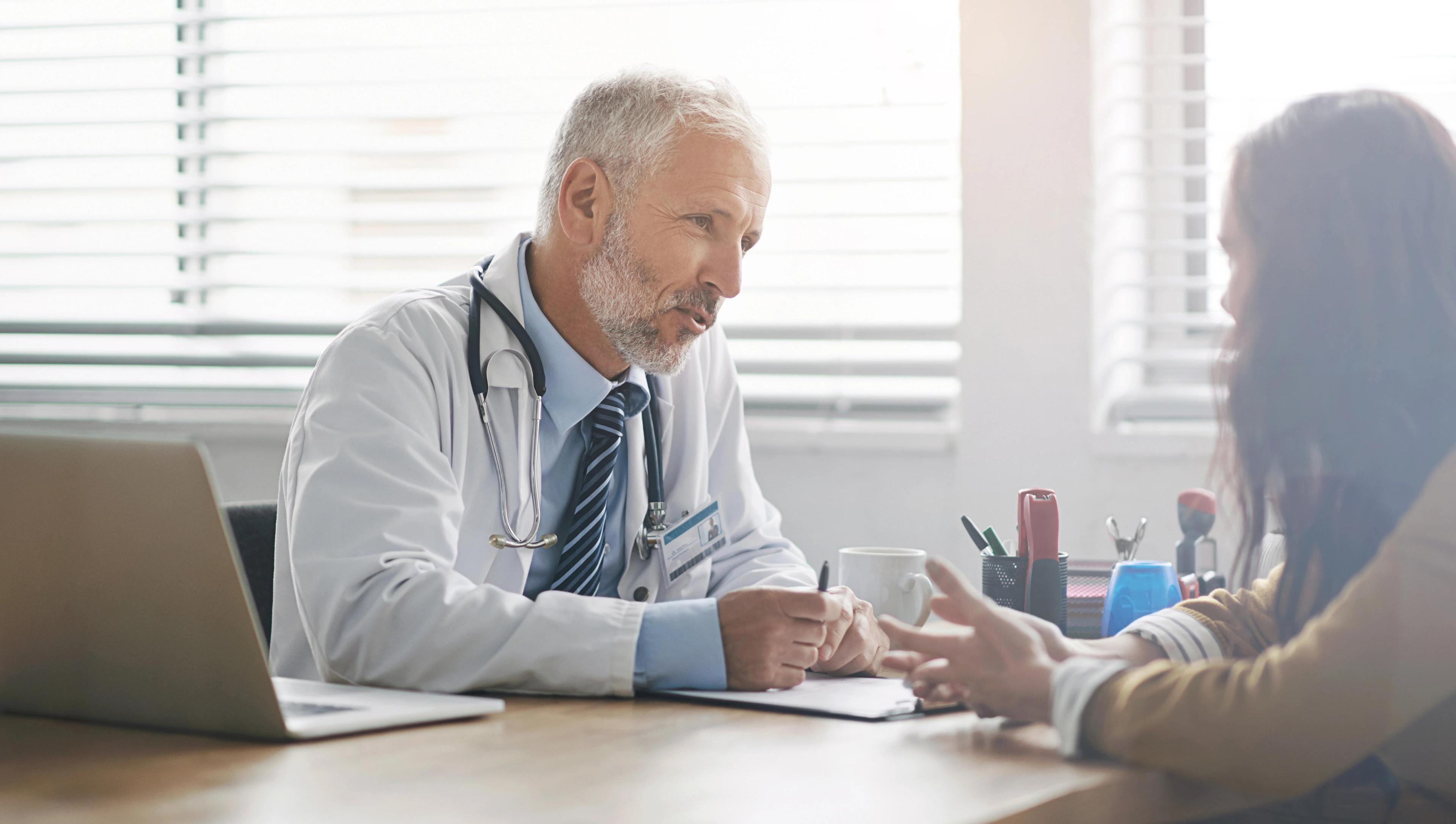 Primary care provider discussing preventive health measures with a patient during a consultation in Charlotte, NC