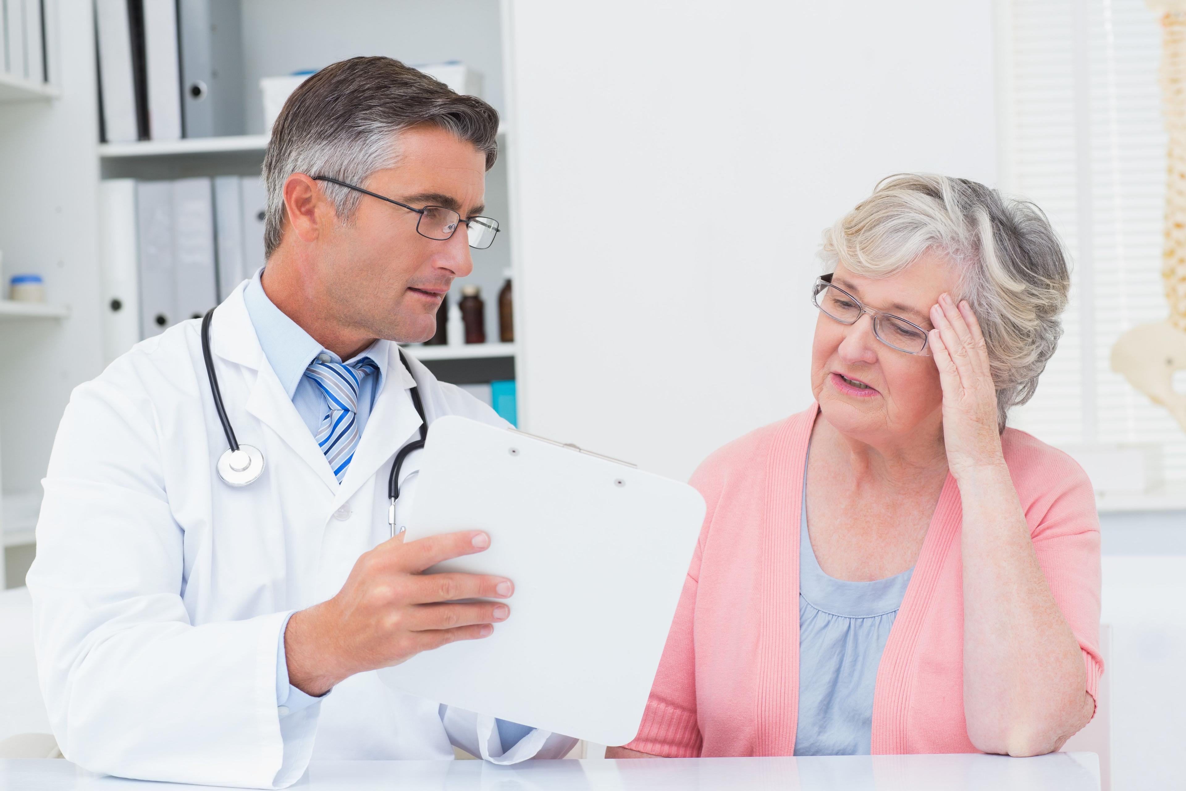 Doctor discussing a personalized care plan with an elderly patient at Fanous Clinic in Charlotte NC, showcasing the personalized care strategies for chronic disease management.