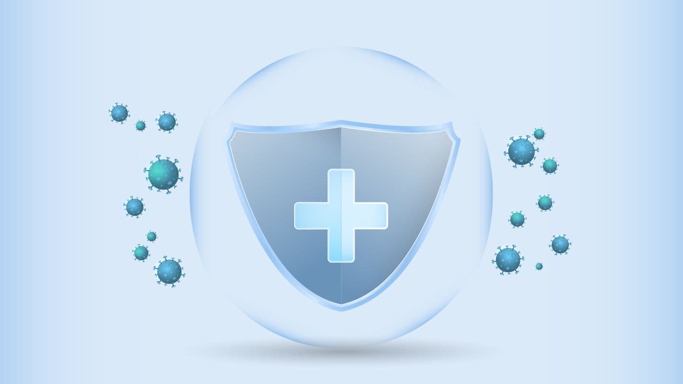 Shield with a medical cross symbol surrounded by virus icons, symbolizing the protection provided by immunizations.